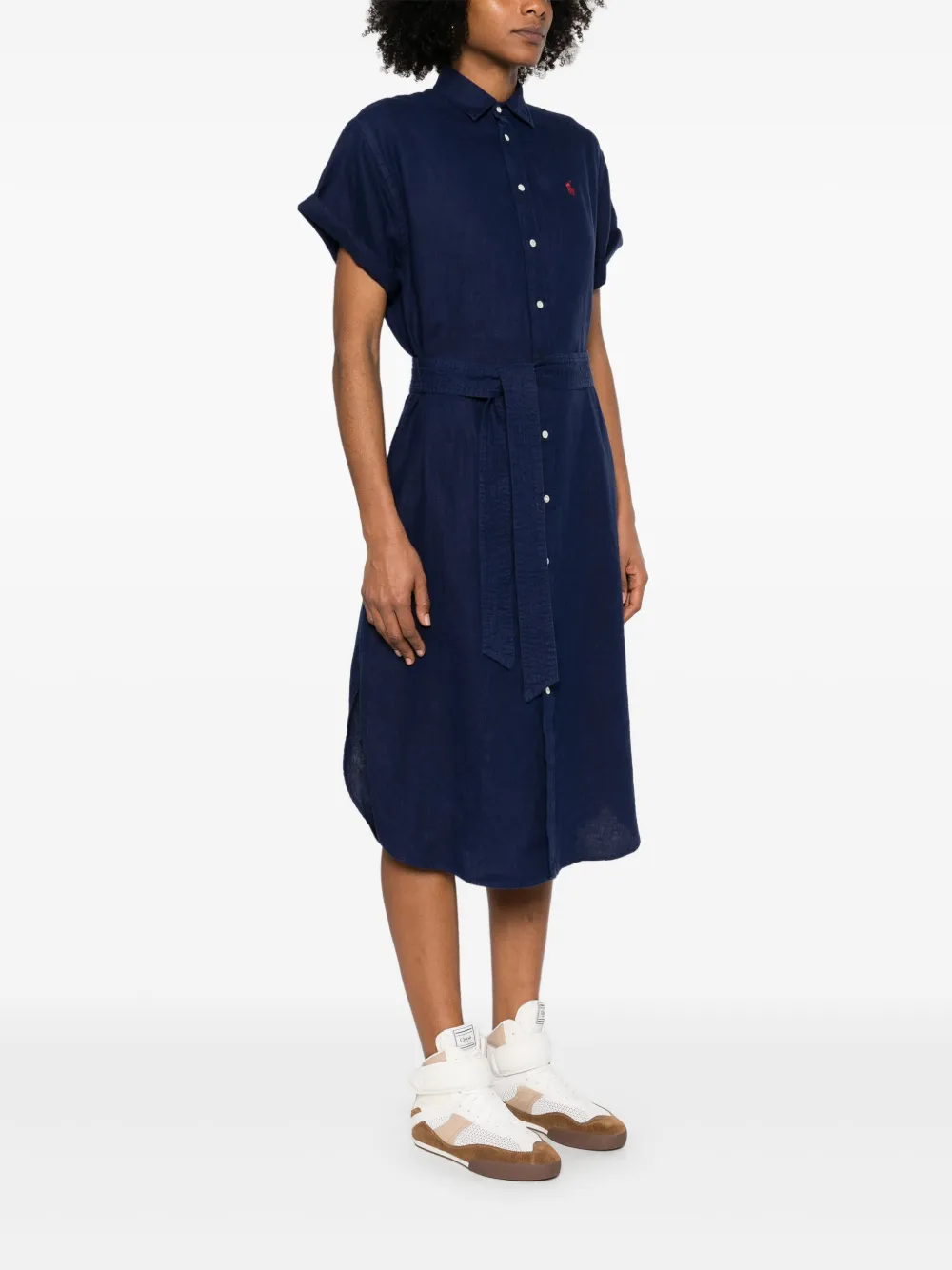 Navy dress worn by a person, showing the dress 's fit