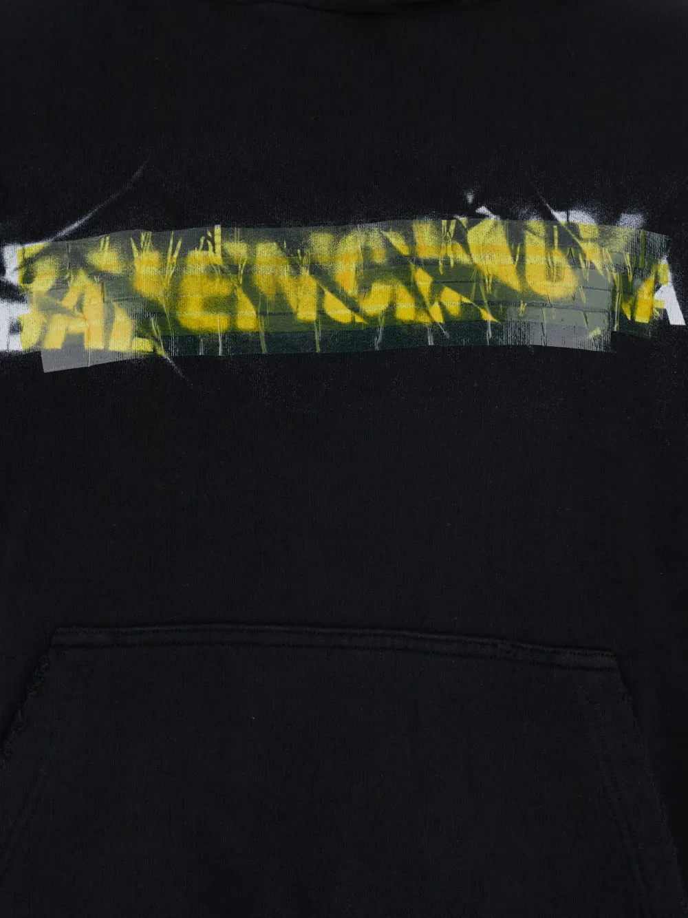 Close up of black hoodie, showing texture of the cotton fabric