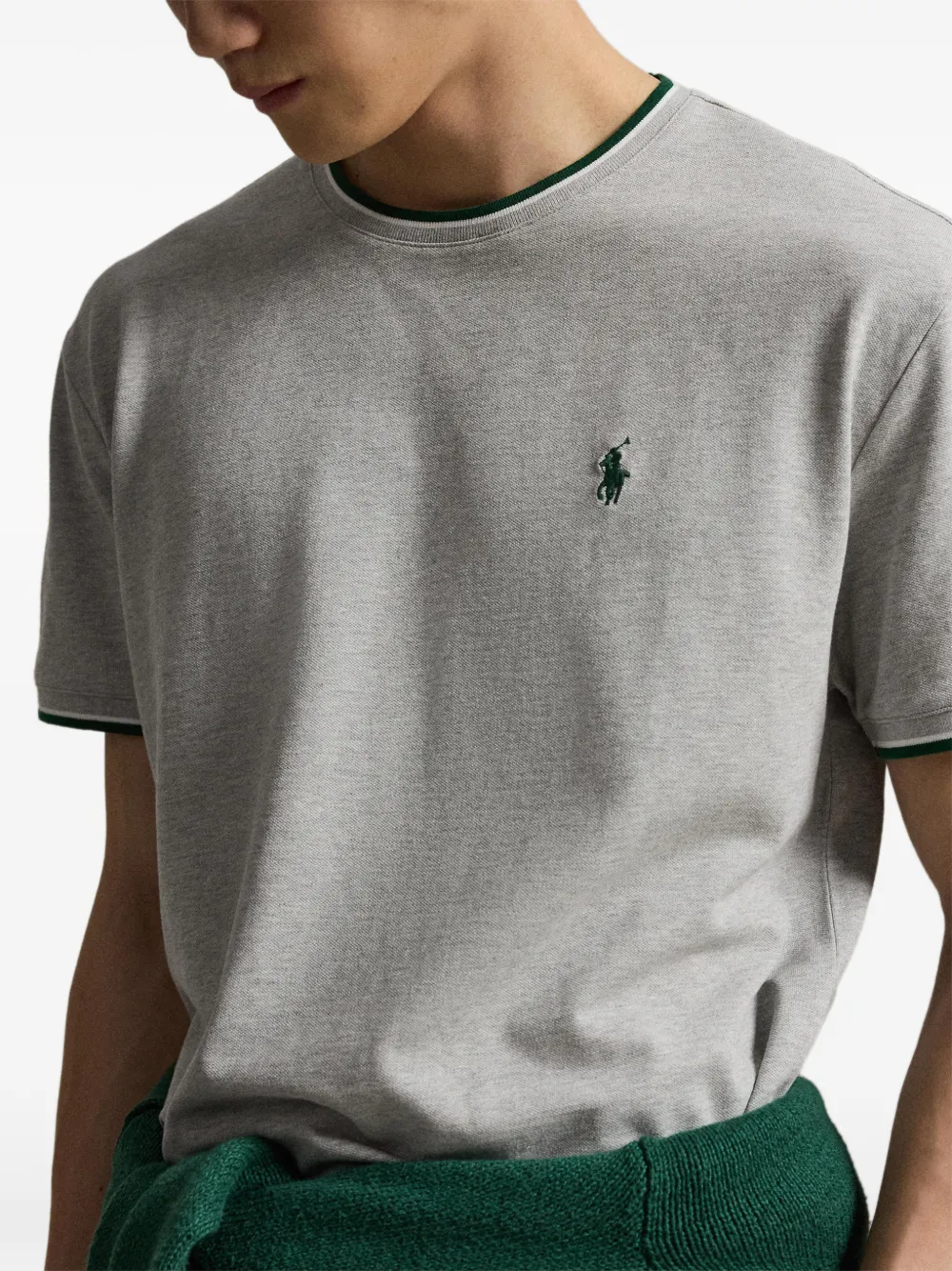 Grey t-shirt worn by a person, showing the t-shirt fit