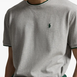 Grey t-shirt worn by a person, showing the t-shirt fit