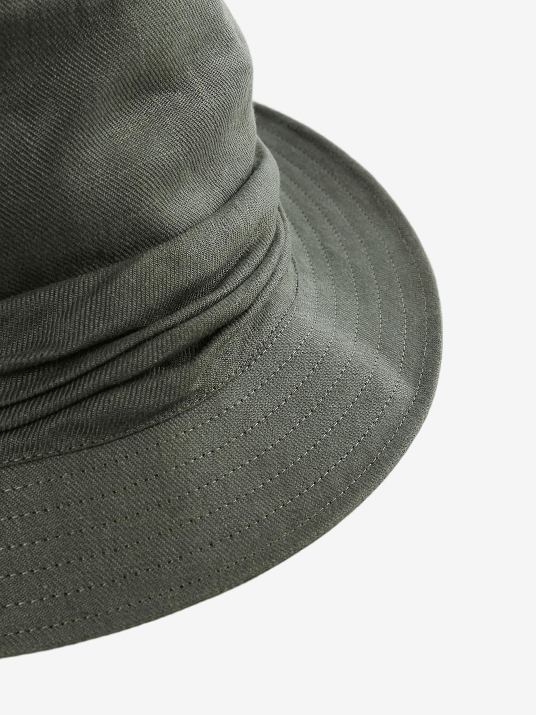 Close-up of a green bucket hat on a white background