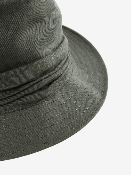 Close-up of a green bucket hat on a white background