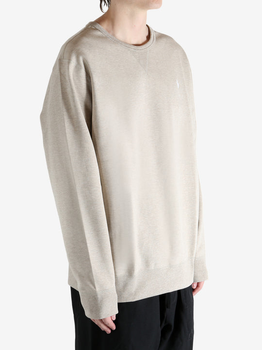 Tan shirts worn by a person, showing the shirts fit