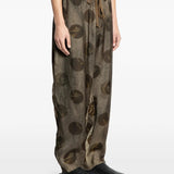 Grey pants worn by a person, showing the pants fit