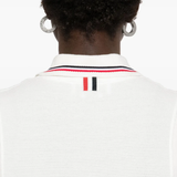 Close up of white dress, showing texture of the cotton fabric