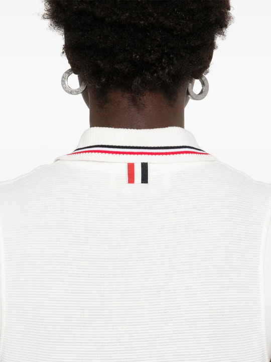 Close up of white dress, showing texture of the cotton fabric