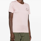 Pink t-shirt worn by a person, showing the t-shirt fit