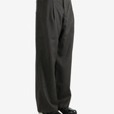 Brown pants worn by a person, showing the pants's fit