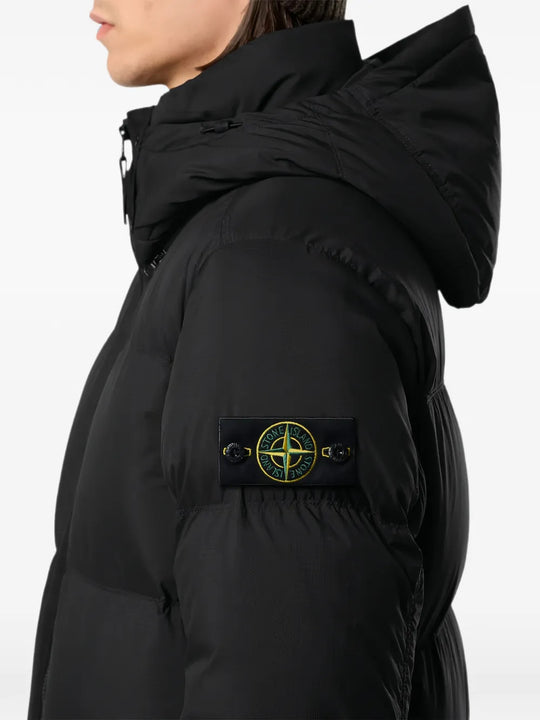 Black jacket worn by a person, showing the jacket fit