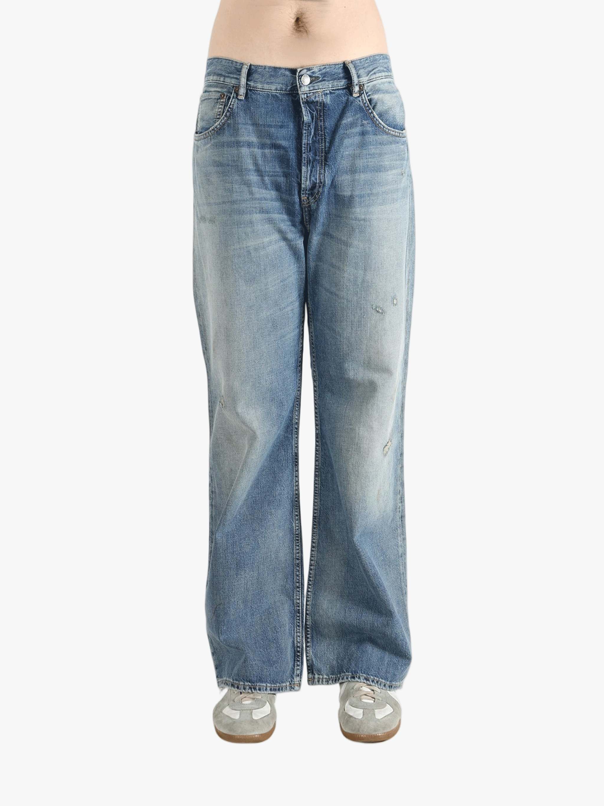 Blue jean worn by a person, showing the cow leather fit