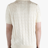 White shirt worn by a person, showing the shirt's fit