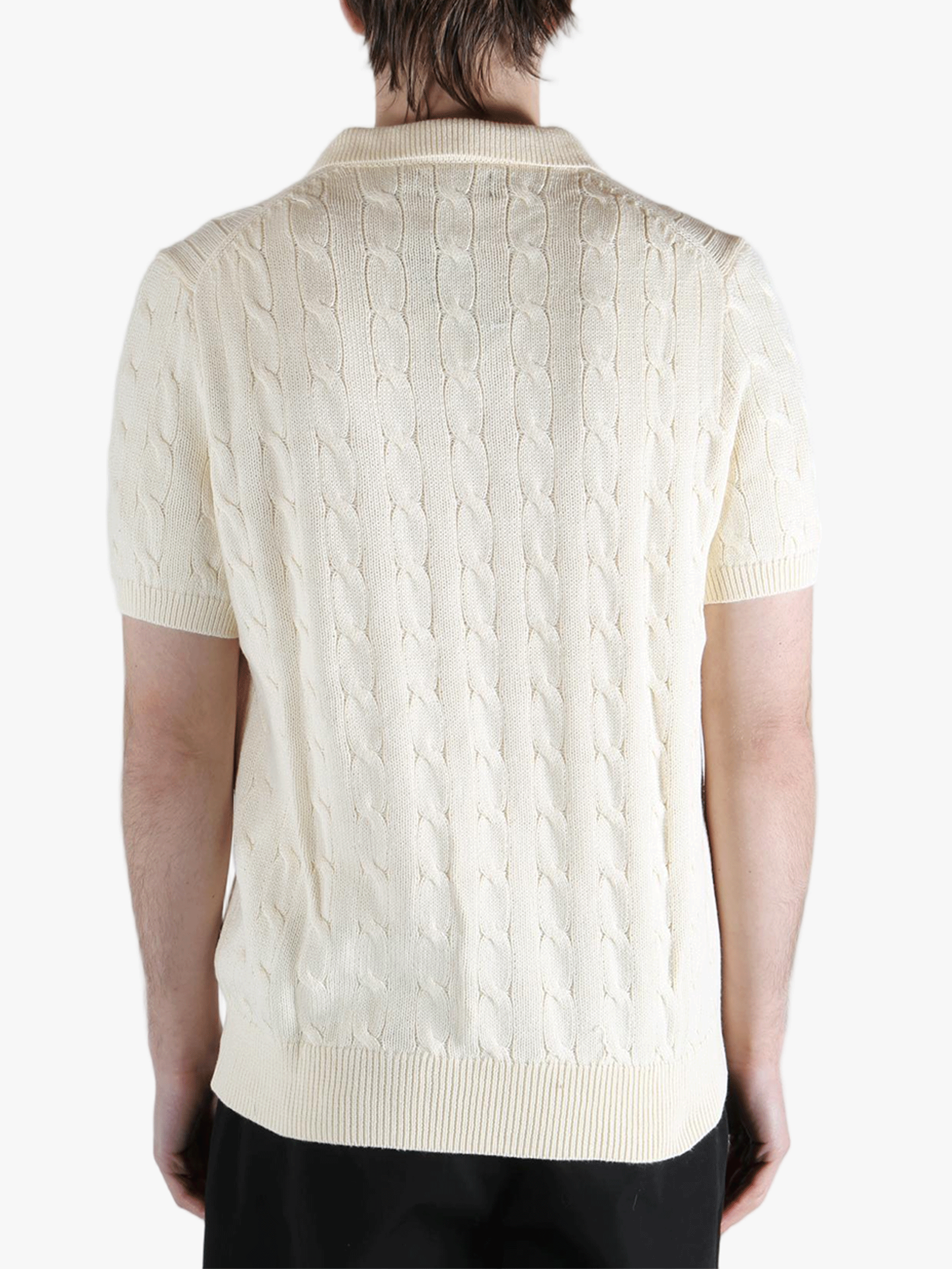 White shirt worn by a person, showing the shirt's fit