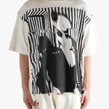 White t-shirt worn by a person, showing the t-shirt's fit