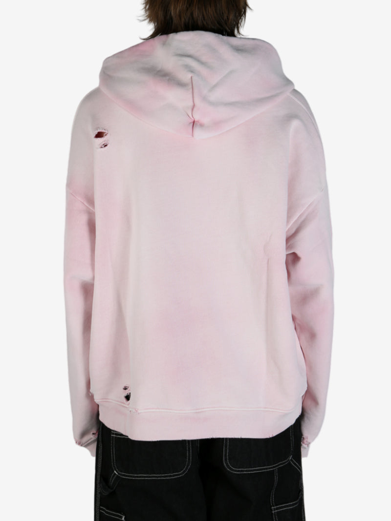 Pink sweatshirt worn by a person, showing the sweatshirt fit