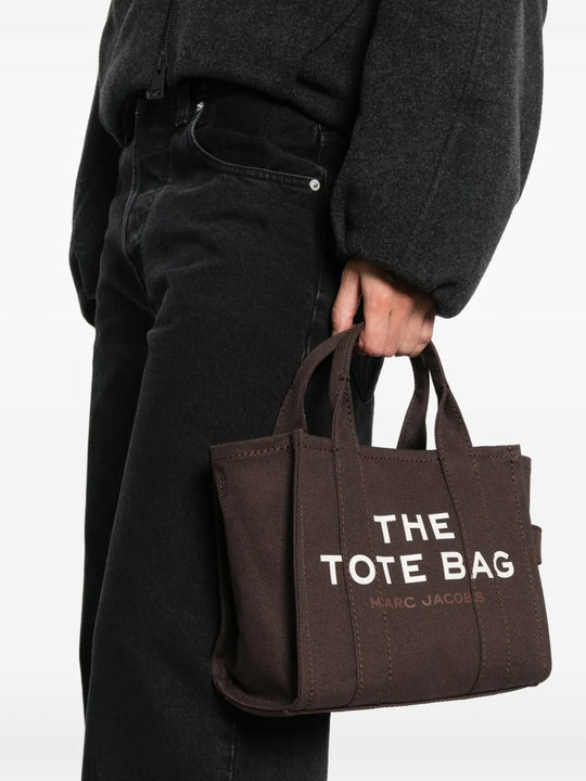 Brown bag carried by a person, showing the bag's size