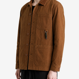 Brown shirt worn by a person, showing the shirt fit