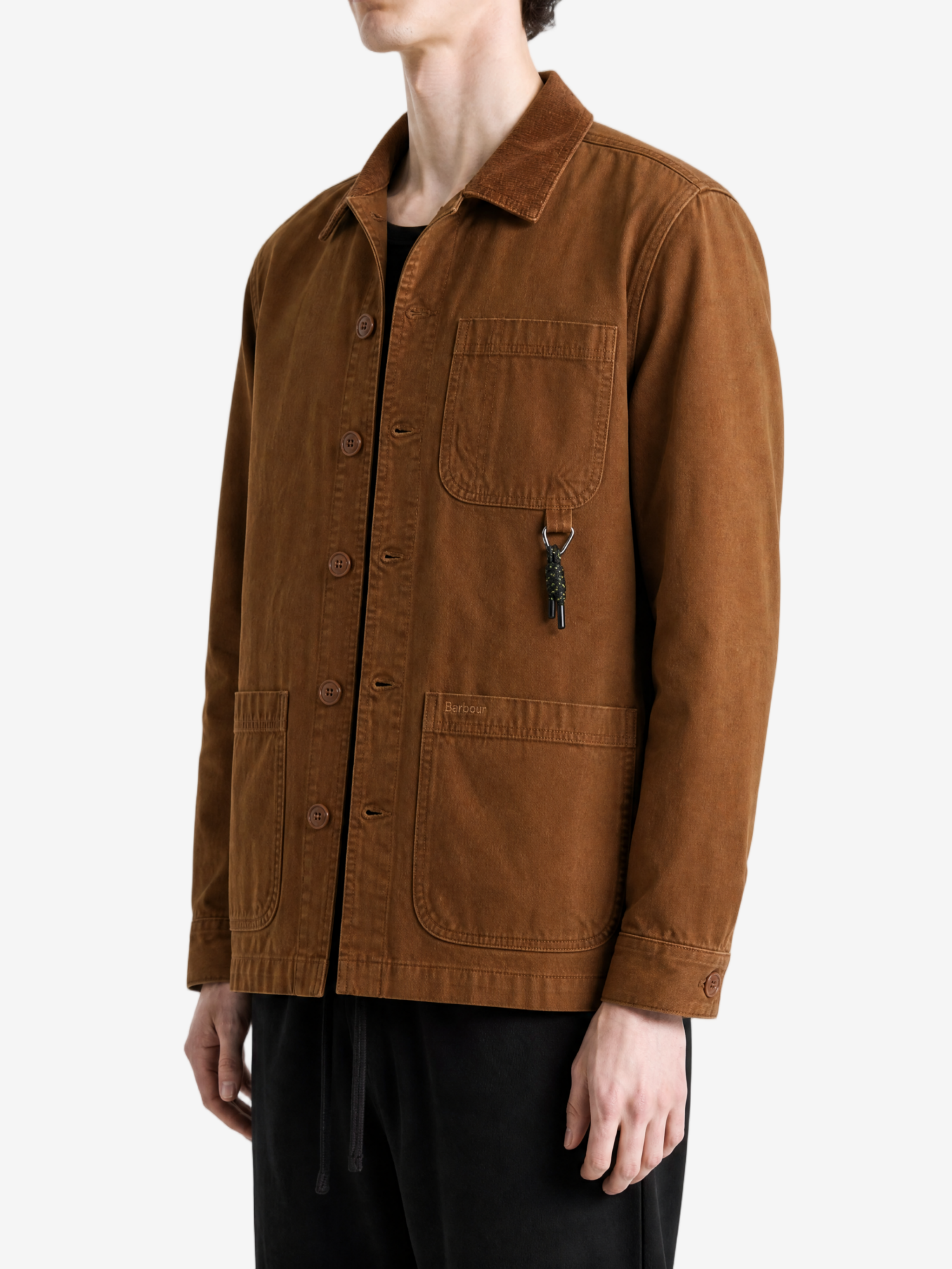 Brown shirt worn by a person, showing the shirt fit