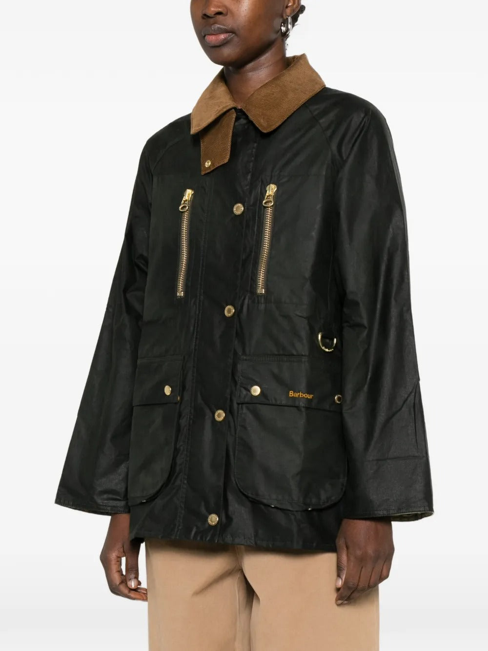 Green jacket worn by a person, showing the jacket's fit