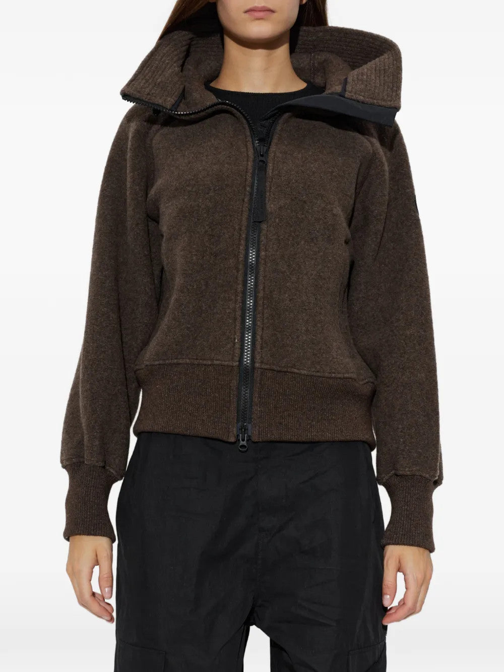 Brown jacket worn by a person, showing the jacket fit