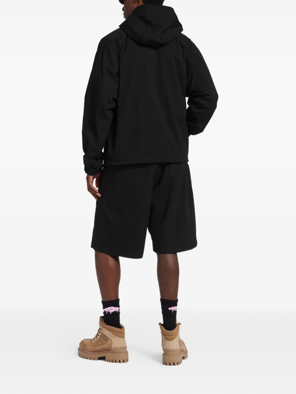 Black jacket worn by a person, showing the jacket's fit