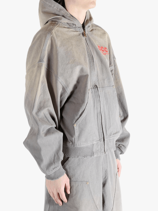 Grey hoodie, worn by a person, showing the hoodies fit