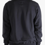 Black shirts worn by a person, showing the shirts fit