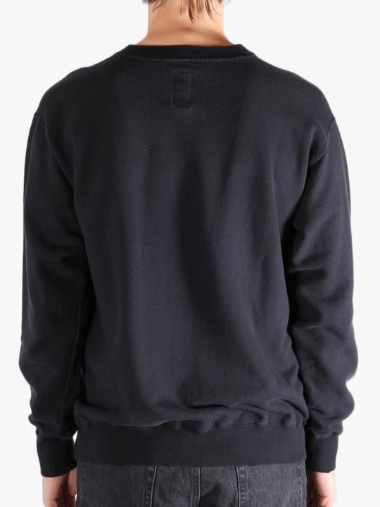 Black shirts worn by a person, showing the shirts fit