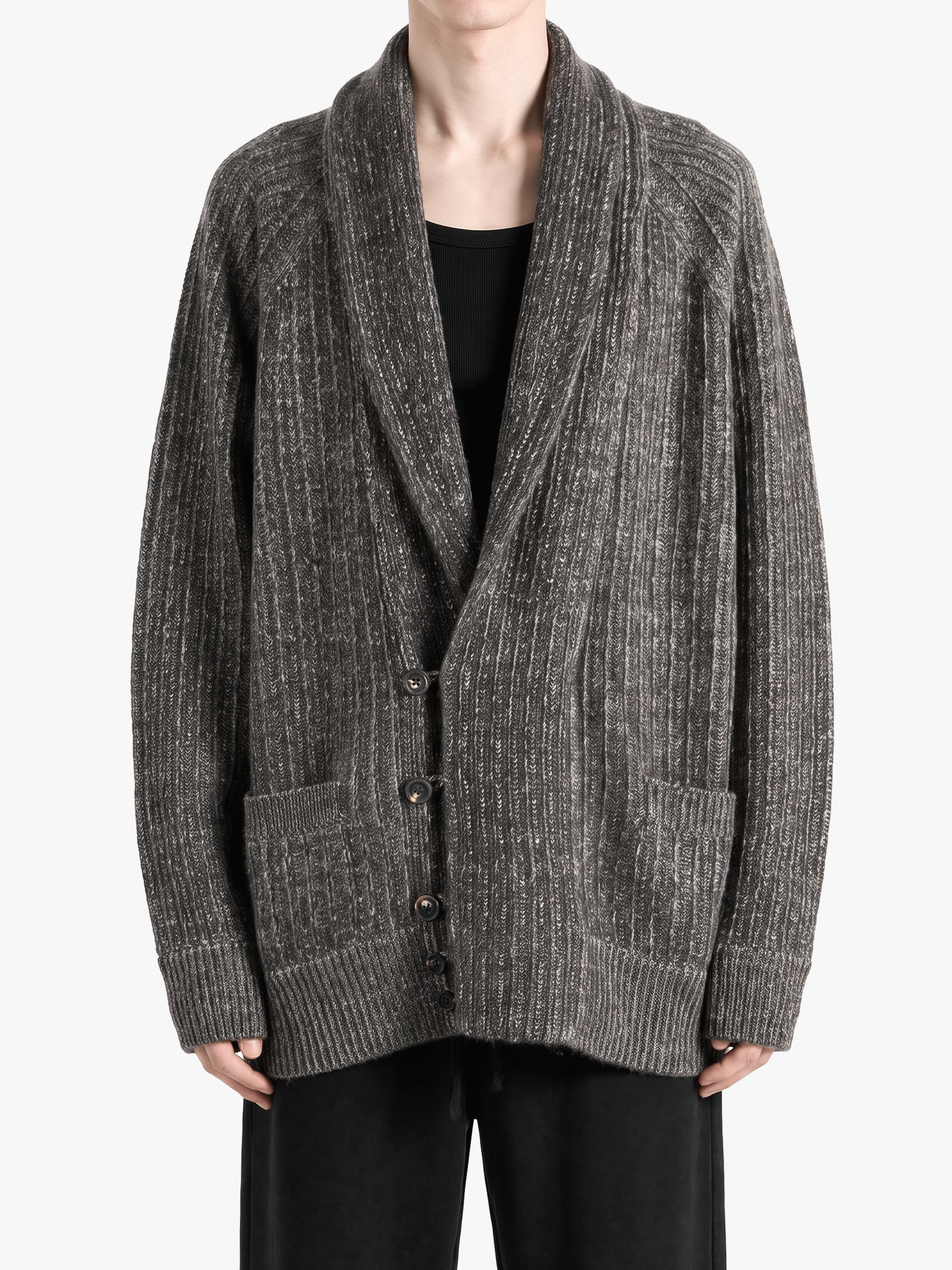 Grey knitwear worn by a person, showing the knitwear fit