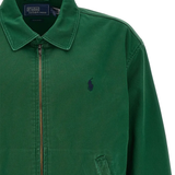 Close up of Green windbreaker, showing texture of the botton fabric