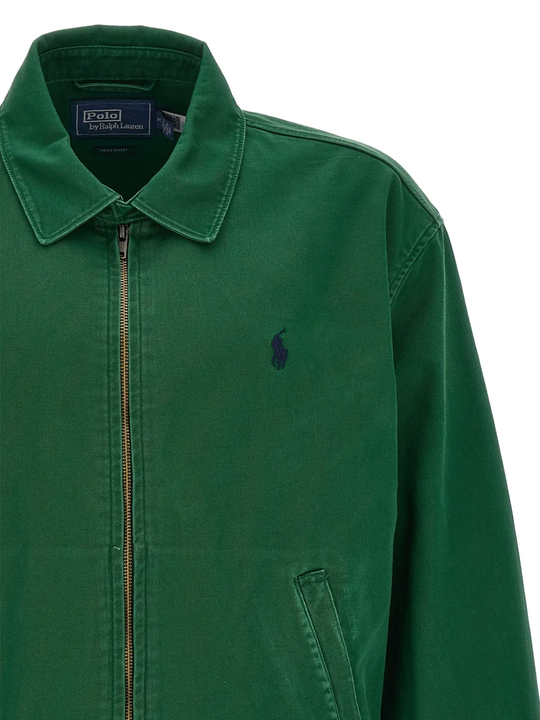 Close up of Green windbreaker, showing texture of the botton fabric