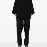 Black t-shirt worn by a person, showing the t-shirt's fit