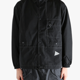 Black jackets worn by a person, showing the jackets fit