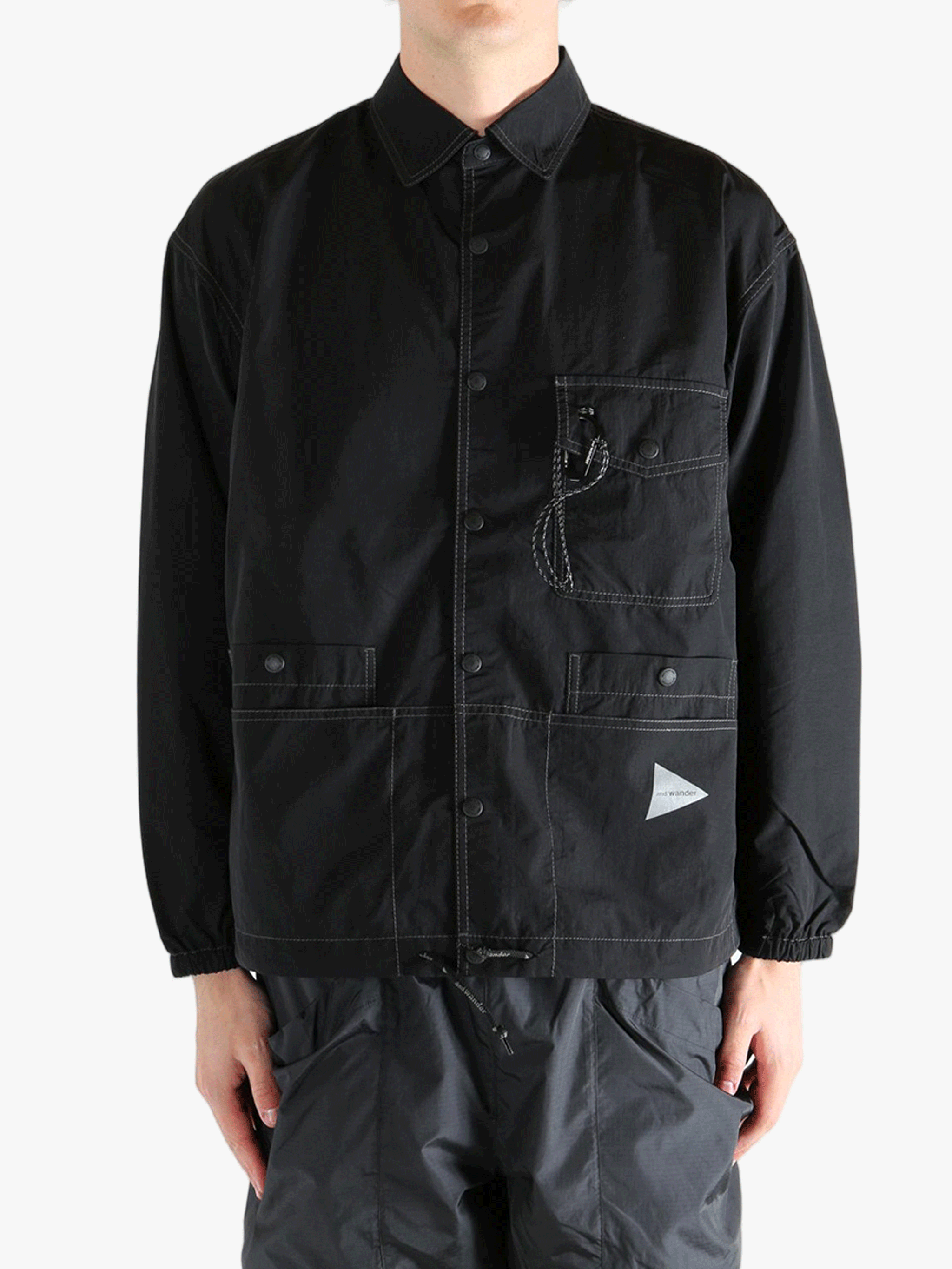 Black jackets worn by a person, showing the jackets fit