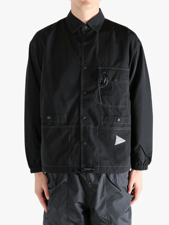 Black jackets worn by a person, showing the jackets fit
