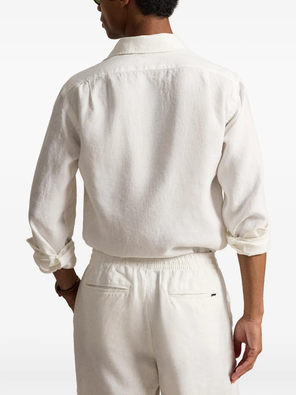 White shirt worn by a person, showing the shirt fit