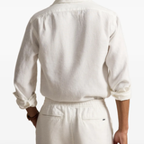White shirt worn by a person, showing the shirt fit