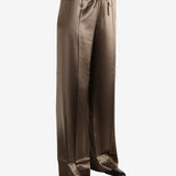 Brown pants worn by a person, showing the pants's fit