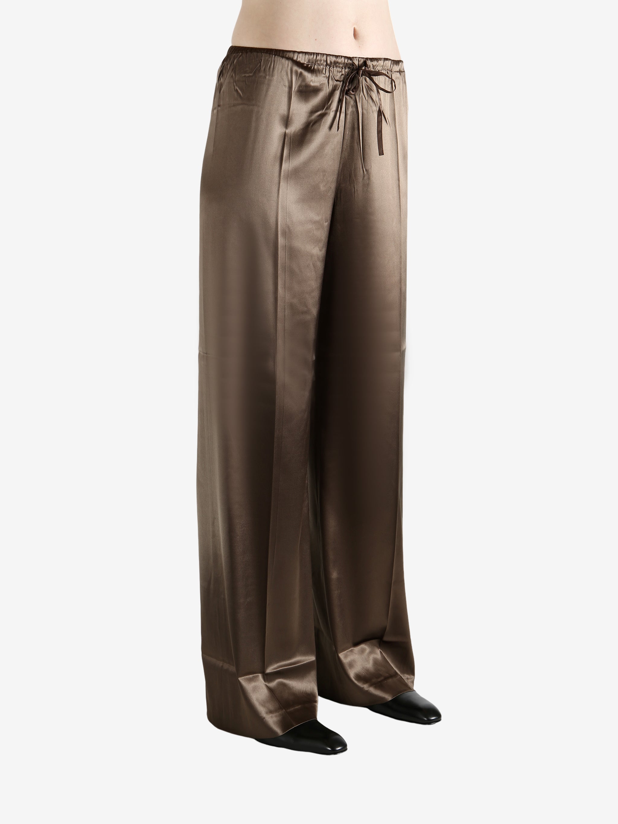 Brown pants worn by a person, showing the pants's fit