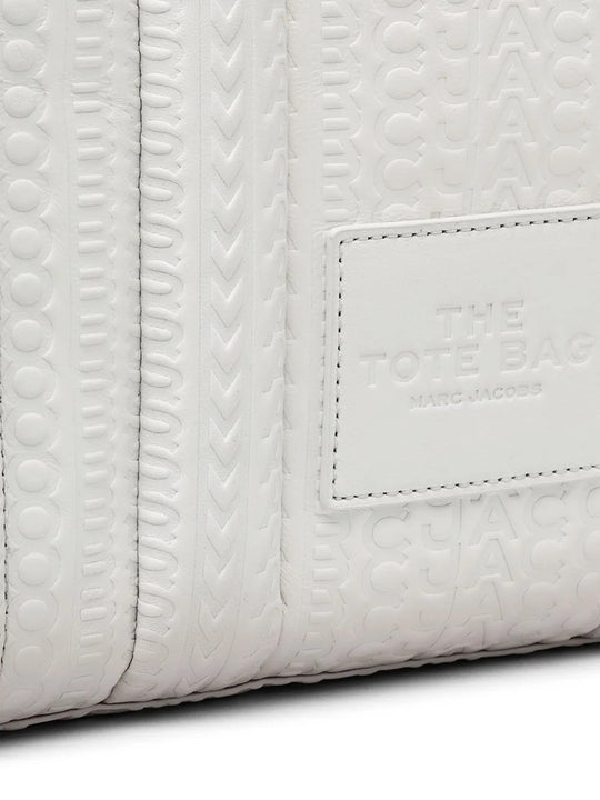 Close up of the white bag, showing texture of the leather fabric