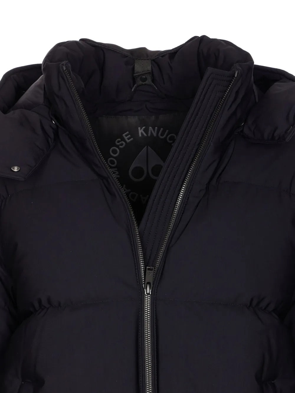 Close up of the black coat, showing texture of the nylon fabric