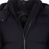 Close up of the black coat, showing texture of the nylon fabric