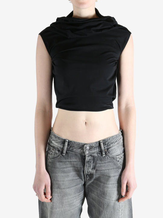 black sleeveless top worn by a person, showing the top fit