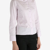 Pink shirt worn by a person, showing the shirt's fit