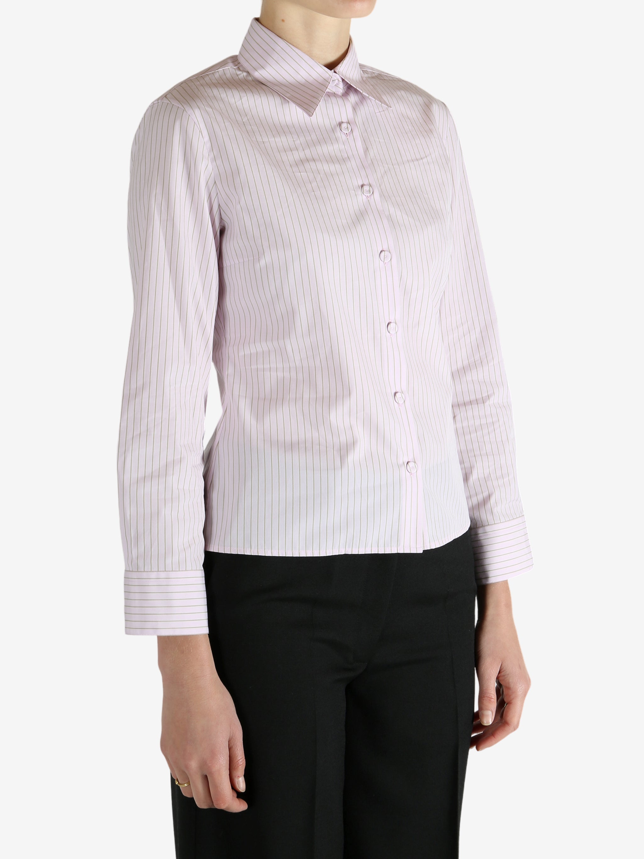 Pink shirt worn by a person, showing the shirt's fit