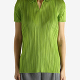 Green shirt worn by a person, showing the shirt's fit