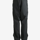 Black pants worn by a person, showing the pants's fit