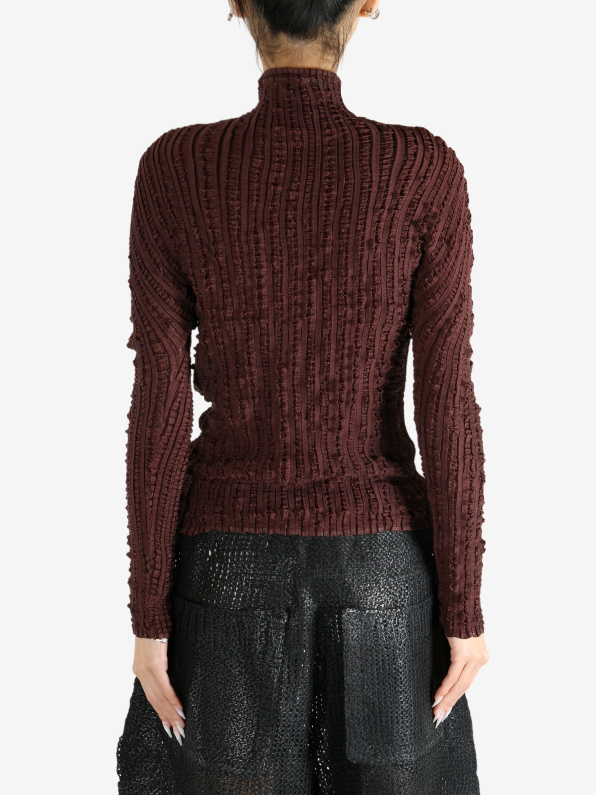 Brown shirt worn by a person, showing the shirt's fit