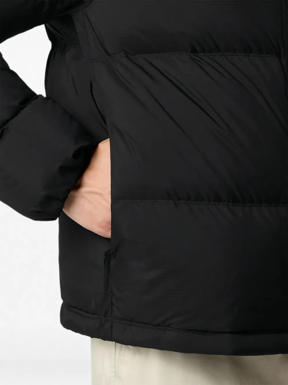 Black jacket worn by a person, showing the jacket fit
