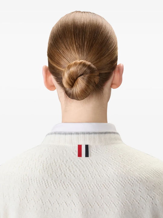 Close up of white knitwear, showing texture of the Wool fabric