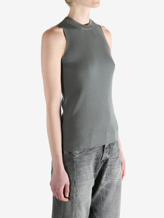 Grey tops worn by a person, showing the tops fit